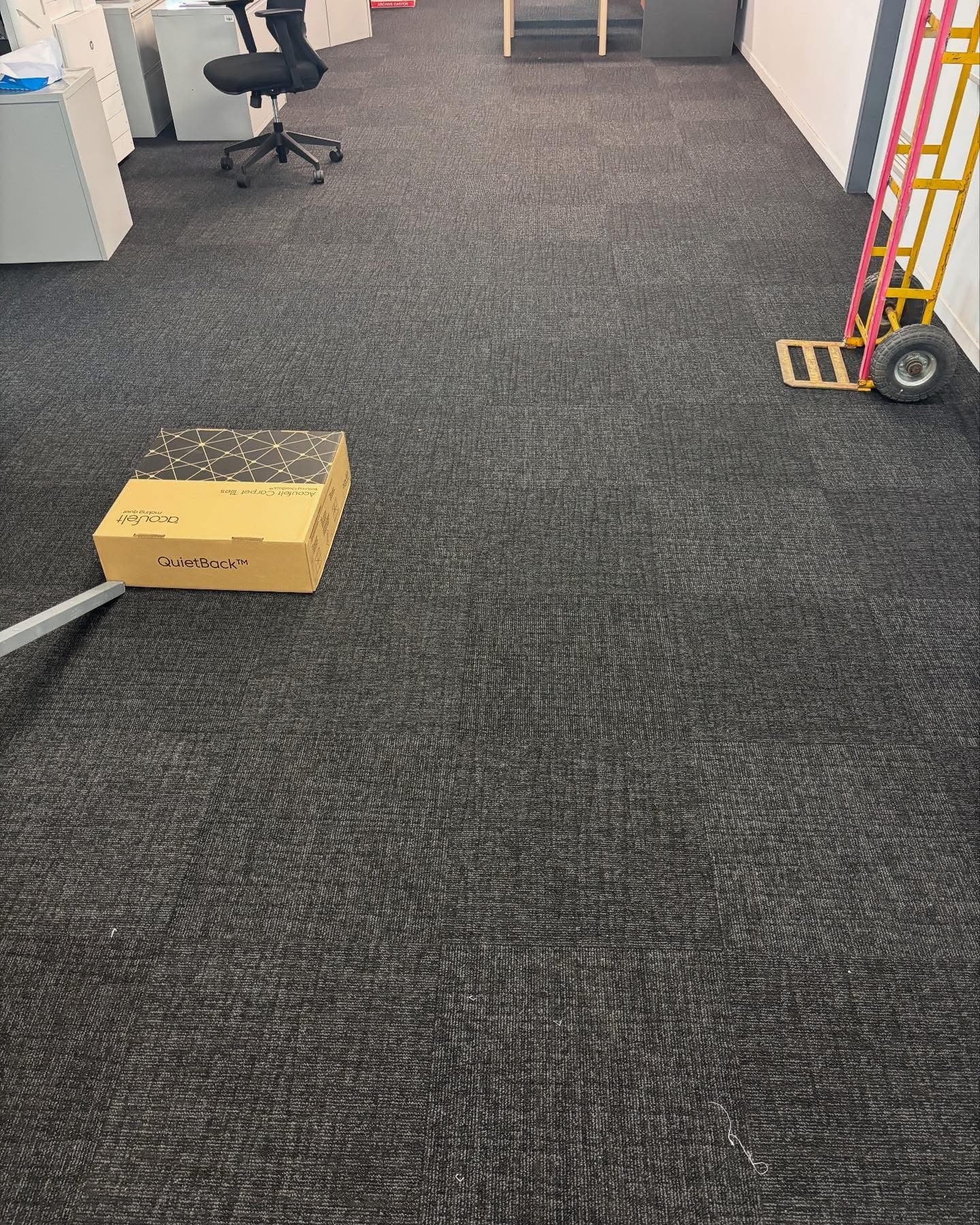 Large open plan floor with commercial carpet tiles