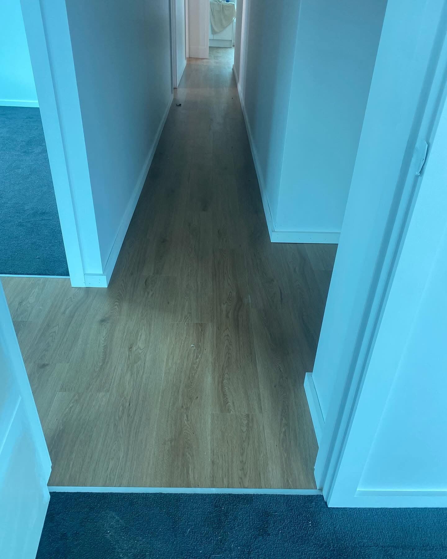 Bedroom corridor with vinyl plank flooring