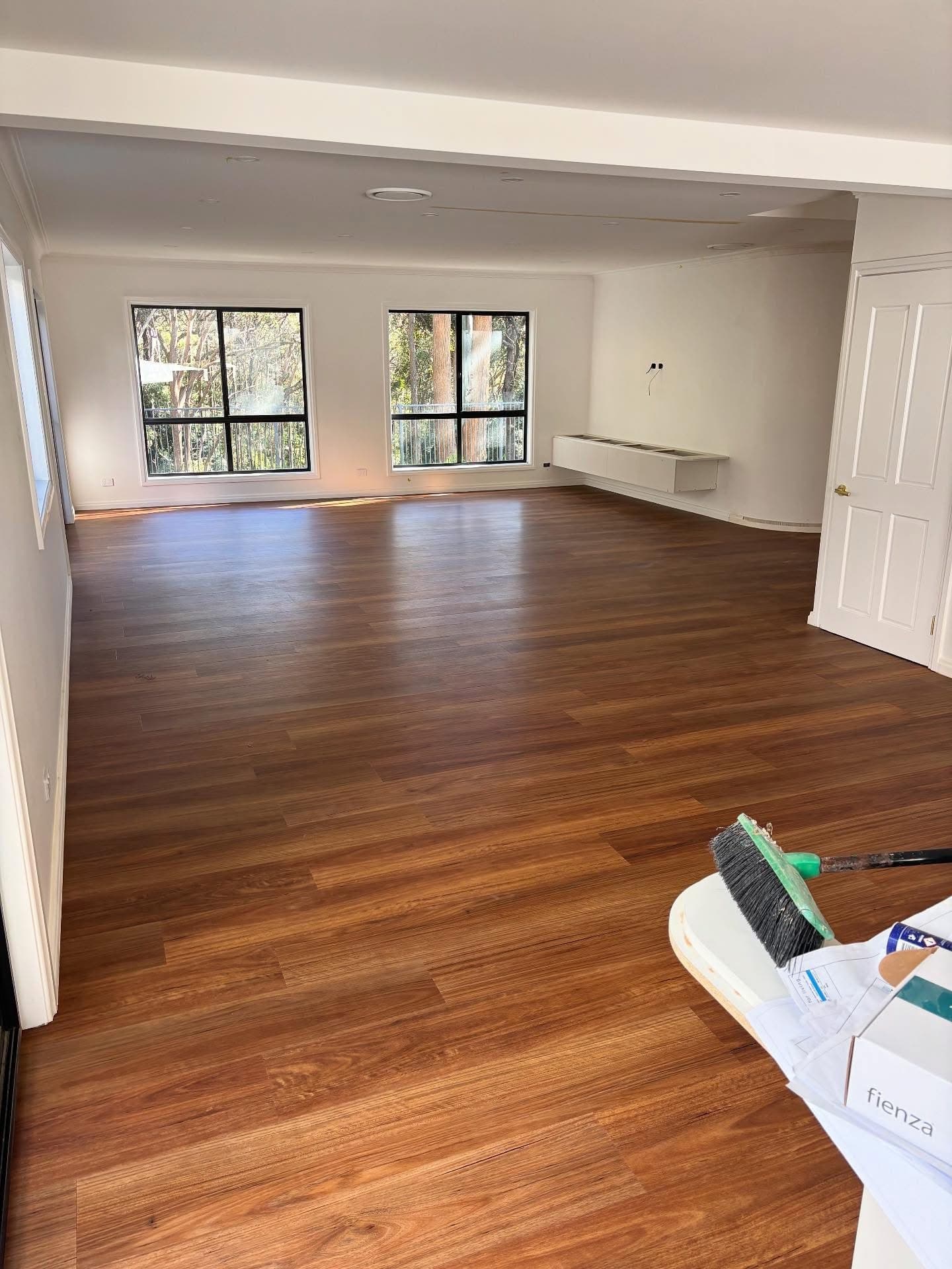 TV and lounge area with completed vinyl plank installation — Gateshead