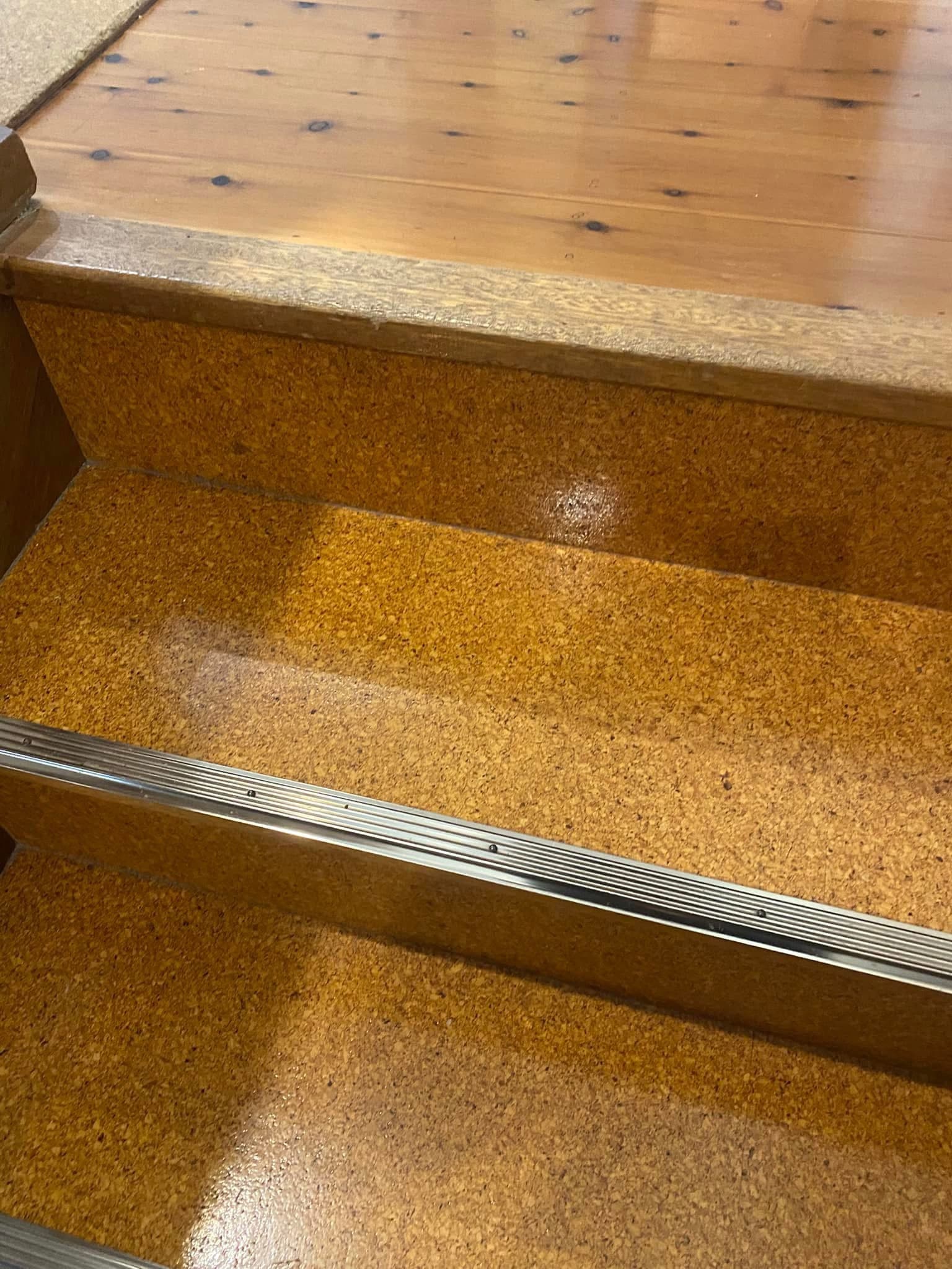 Close-up detail of original carpet stair treads before removal
